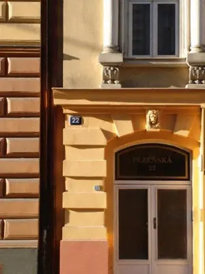 a building with a door with a sign above it at EASY JOURNEY Apartments in Prague