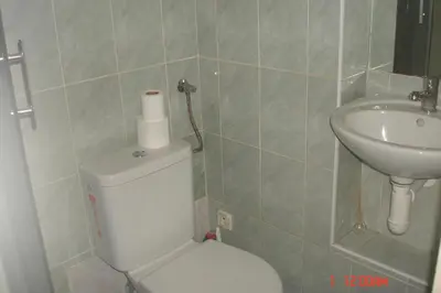a bathroom with a toilet and a sink at EASY JOURNEY Apartments in Prague