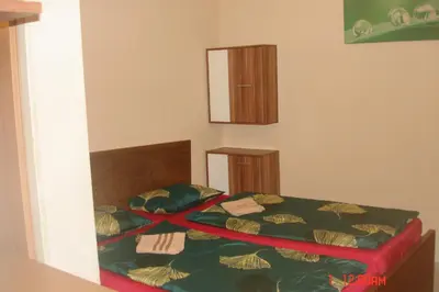 a bedroom with two beds and a mirror on the wall at EASY JOURNEY Apartments in Prague