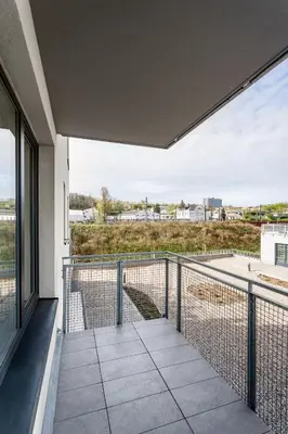 an open balcony with a view of a building at AuriApartments Libeň nový byt 1kk s garáží in Prague