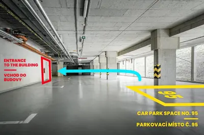an empty parking garage with a car park garage sign at AuriApartments Libeň nový byt 1kk s garáží in Prague