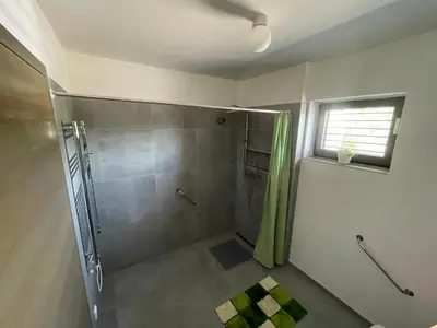 a bathroom with a shower with a shower curtain at Ubytování U Vinice in Mělník
