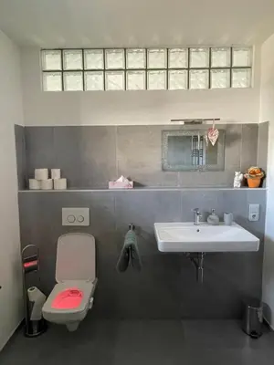 a bathroom with a sink and a toilet at Ubytování U Vinice in Mělník