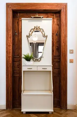 a white dresser with a mirror in a room at Magnificent King Suite in Prague