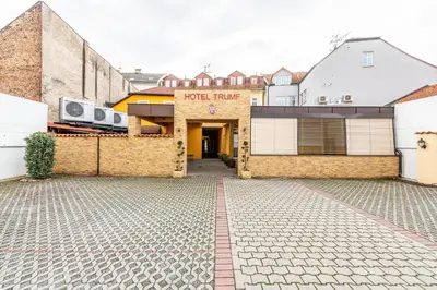 a building with two radios on the side of it at Hotel Trumf in Mladá Boleslav
