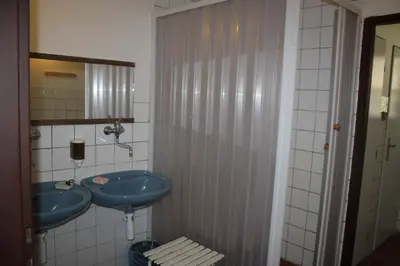 a bathroom with two blue sinks and a mirror at Letní rekreační středisko Schiffler Miroslav in Samopše