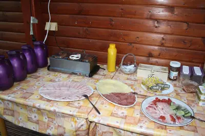 a table with plates of food on top of it at Letní rekreační středisko Schiffler Miroslav in Samopše