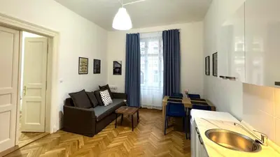 a living room with a couch and a table at Side Street Apartments in Prague