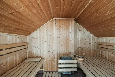 a wooden sauna with wooden walls and wooden floors at LUXURY CENTRAL PENTHOUSE WITH SAUNA, TERRACE, 250m2, 5BDRM, 3BTHRM in Prague