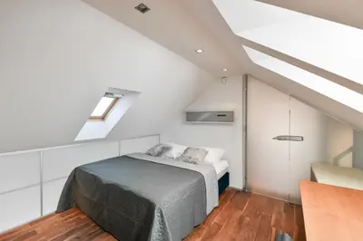 a bedroom with a bed in a attic at LUXURY CENTRAL PENTHOUSE WITH SAUNA, TERRACE, 250m2, 5BDRM, 3BTHRM in Prague