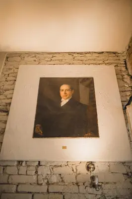 a painting of a man on a brick wall at King Charles Apartment in Prague