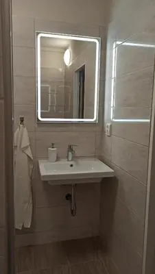 a bathroom with a sink and a mirror at Apartment Dream in Prague