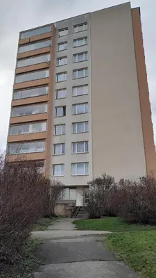 a tall building with a driveway in front of it at Apartment Dream in Prague
