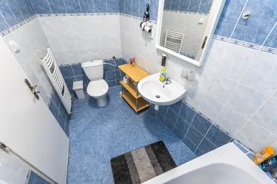 an overhead view of a bathroom with a toilet and a sink at Wenceslas Square 2 Bedroom Apartment in Prague
