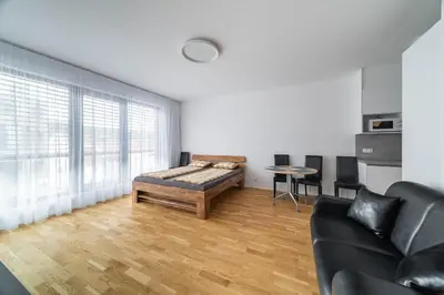 a living room with a couch and a table at Apartment Michelská in Prague