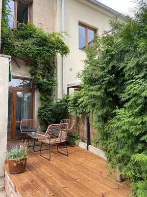 a patio with two chairs and a table at Apartments Old Town in Brandýs nad Labem-Stará Boleslav