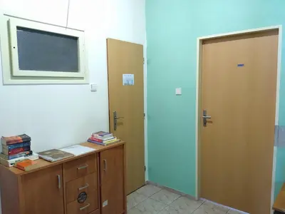 a room with a door and a desk and a window at Best Location in Prague - Old Town in Prague