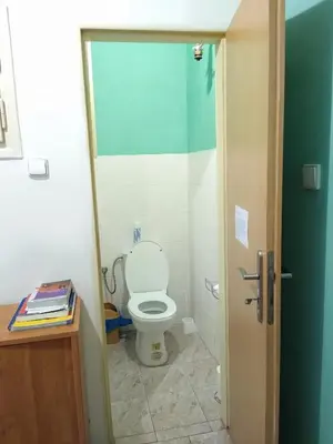 a bathroom with a white toilet in a room at Best Location in Prague - Old Town in Prague