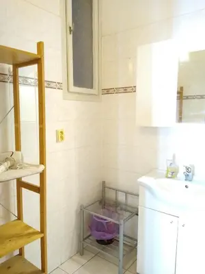 a bathroom with a sink and a washing machine at Best Location in Prague - Old Town in Prague