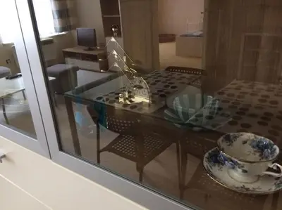 a glass table with a bowl on top of it at Nice big apartment in the city center in Prague
