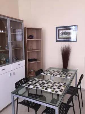 a dining room with a glass table and chairs at Nice big apartment in the city center in Prague