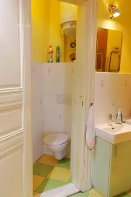a bathroom with a toilet and a sink at Nice big apartment in the city center in Prague