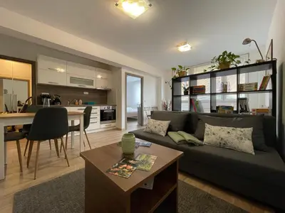 a living room with a couch and a table at Beroun apartments in Beroun