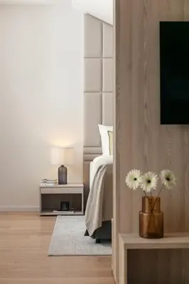a bedroom with a bed and a tv on a wall at U Pujcovny Apartment Old Town Prague in Prague
