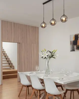 a dining room with a white table and white chairs at U Pujcovny Apartment Old Town Prague in Prague