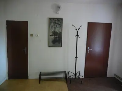 a room with two doors and a pole on the wall at Apartmán u zámku in Smečno