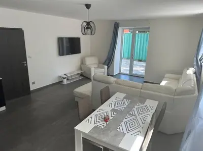 a living room with a couch and a table at Byt 71m2 klid pohoda a příroda in Prague
