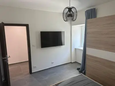 a living room with a flat screen tv on the wall at Byt 71m2 klid pohoda a příroda in Prague