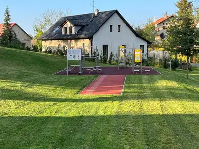 a playground in front of a white building at Byt 71m2 klid pohoda a příroda in Prague