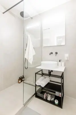 a bathroom with a sink and a mirror at Cozy & New Studio Apartment PEACE SQ. in Prague