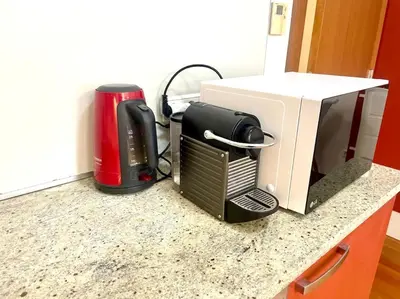 a microwave and a toaster on a kitchen counter at Entire Apartment, near Clarion, O2 Arena, Metro 3 min, Easter market in City Center 15 min in Prague