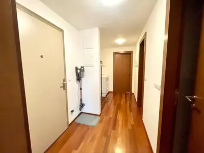 an empty room with a hallway with a hard wood floor at Entire Apartment, near Clarion, O2 Arena, Metro 3 min, Easter market in City Center 15 min in Prague