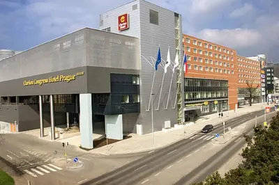 a large building on a city street with a road at Entire Apartment, near Clarion, O2 Arena, Metro 3 min, Easter market in City Center 15 min in Prague