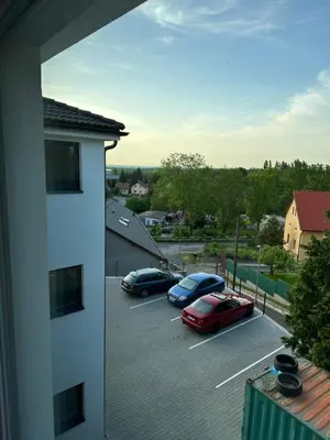 a view of cars parked in a parking lot at Apartmán byt 75m2 klid příroda pro rodinu in Prague