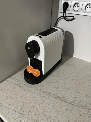 a toaster sitting on a counter with two oranges at Apartmán byt 75m2 klid příroda pro rodinu in Prague