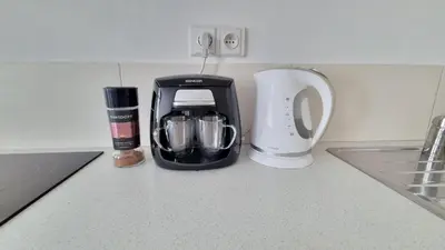 a coffee maker sitting on a kitchen counter at Finnem Rentals Tyršova in Prague