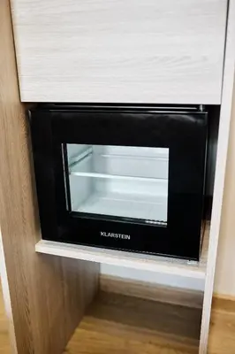 a microwave oven sitting inside of a cabinet at Residence 44 in Prague