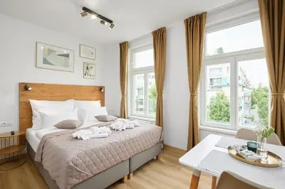a bedroom with a bed with two towels on it at Residence 44 in Prague