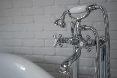 a chrome shower faucet in a bathroom at Domus Balthasar Boutique Hotel in Prague