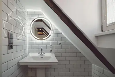 a bathroom with a sink and a mirror at Domus Balthasar Boutique Hotel in Prague