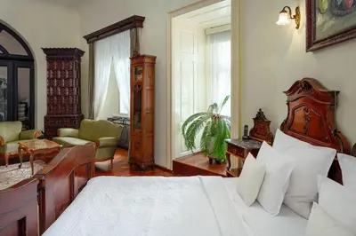 a bedroom with a bed and a living room at Prague Old Street Apartments in Prague