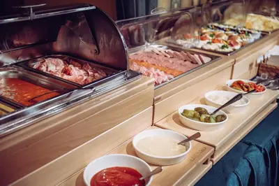 a buffet line with many different types of food at Prague Old Street Apartments in Prague