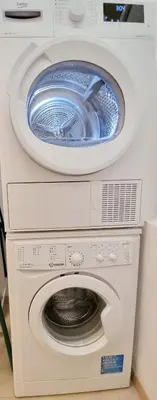 two washing machines stacked on top of each other at Finnem Rentals Pod Znonařkou in Prague