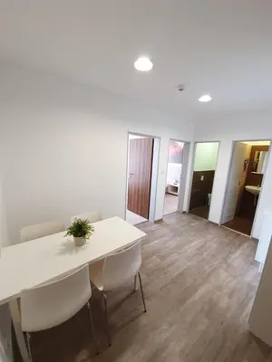 a dining room with a white table and chairs at Hotel Energie in Prague