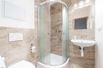 a bathroom with a shower and a sink at Brand new studio apartment # 42 in brand new building with free parking in the center in Prague