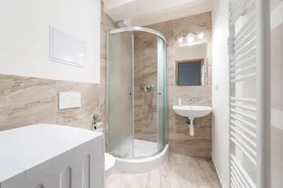 a bathroom with a shower and a sink at Brand new studio apartment # 42 in brand new building with free parking in the center in Prague